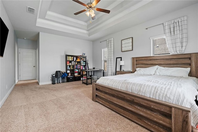 13077 Tara Point Dr, Mobile, AL 36695 - bedroom featuring multiple windows, light colored carpet, a raised ceiling, baseboards, and crown molding
