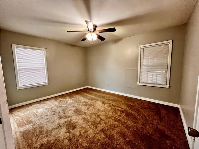 carpeted spare room with ceiling fan