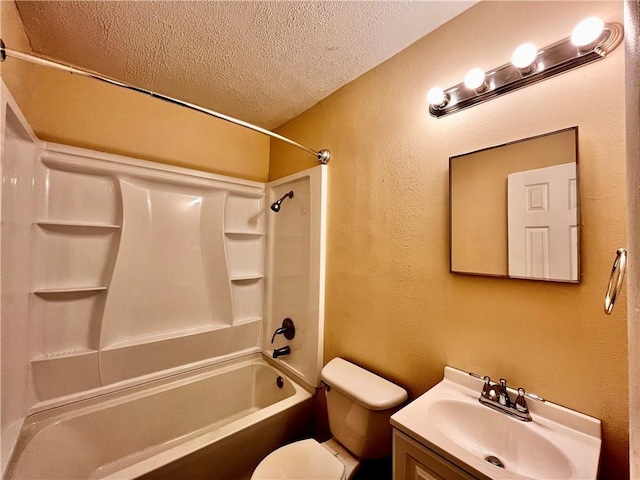 full bathroom with a textured ceiling, shower / washtub combination, vanity, and toilet