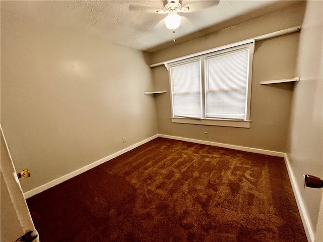 spare room featuring a textured ceiling, ceiling fan, and carpet flooring