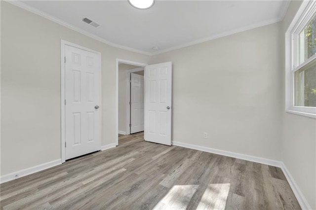 355 La Rose Dr, Mobile, AL 36609 - unfurnished bedroom with wood finished floors, baseboards, and ornamental molding
