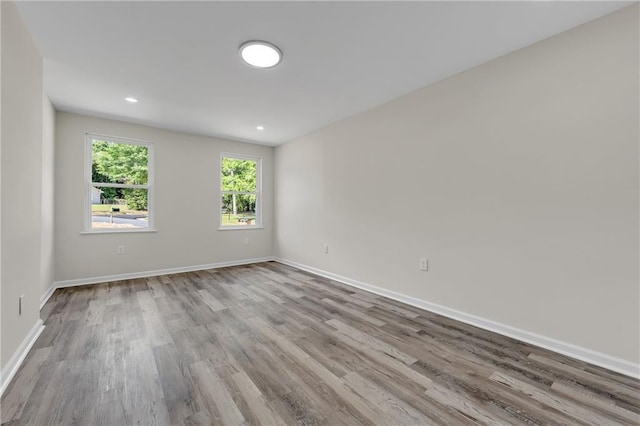 355 La Rose Dr, Mobile, AL 36609 - spare room with wood finished floors, baseboards, and recessed lighting