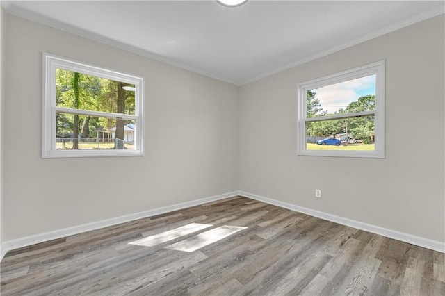 355 La Rose Dr, Mobile, AL 36609 - empty room with crown molding, wood finished floors, and baseboards