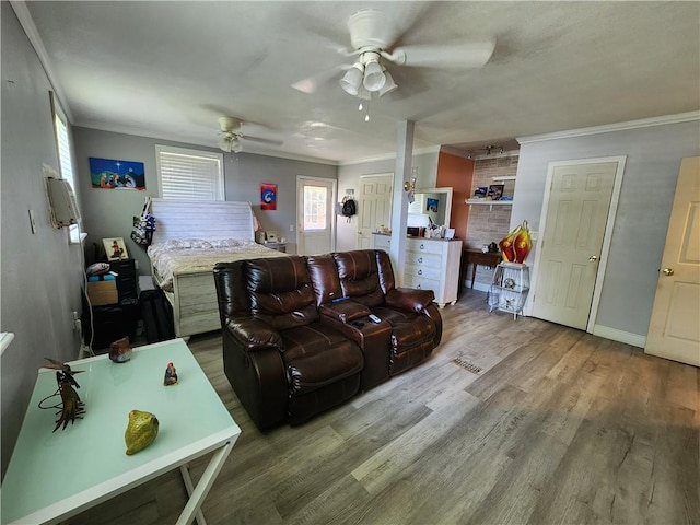 8560 Sadie Ct, Grand Bay, AL 36541 - living area featuring ornamental molding, a ceiling fan, and wood finished floors