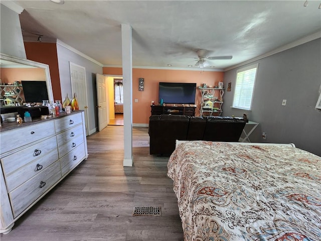 8560 Sadie Ct, Grand Bay, AL 36541 - bedroom with crown molding, wood finished floors, and a ceiling fan
