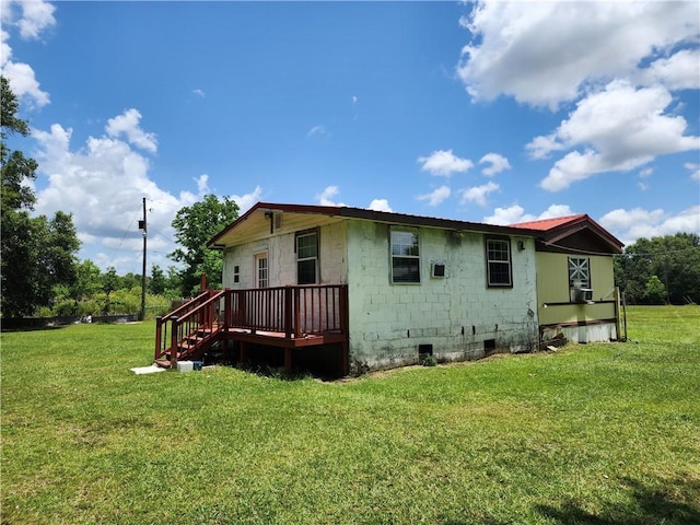 8560 Sadie Ct, Grand Bay, AL 36541 - rear view of house with a deck, a lawn, and concrete block siding