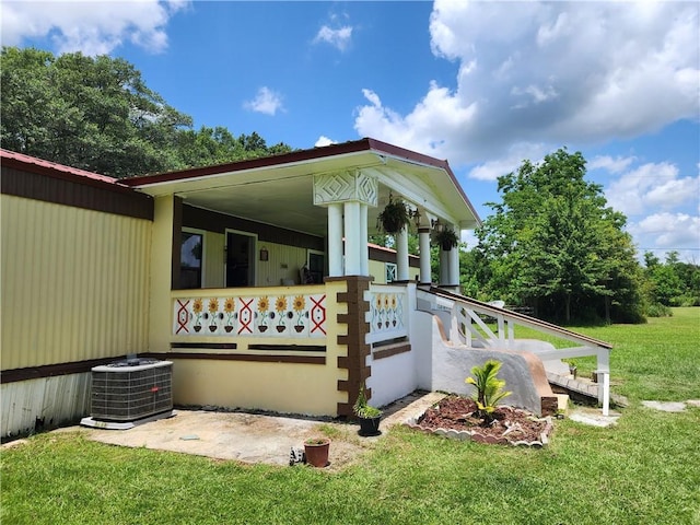 8560 Sadie Ct, Grand Bay, AL 36541 - view of side of property featuring a central AC unit and a lawn