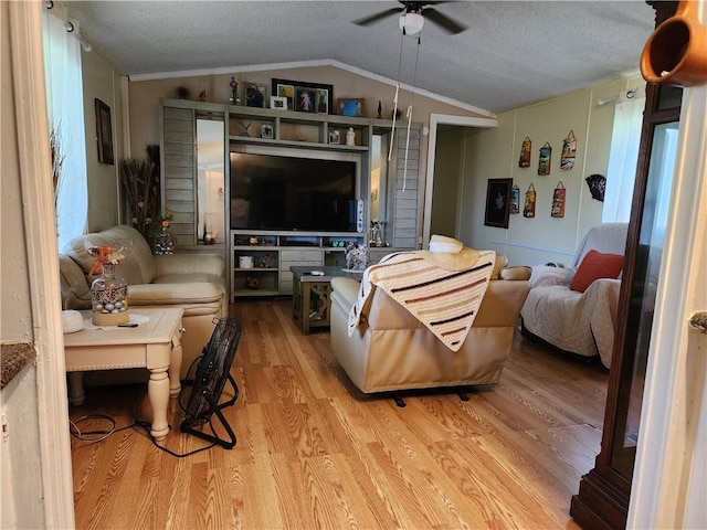 8560 Sadie Ct, Grand Bay, AL 36541 - living area with ceiling fan, vaulted ceiling, light wood-style flooring, and a textured ceiling