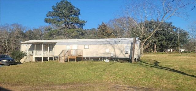 rear view of property with a yard