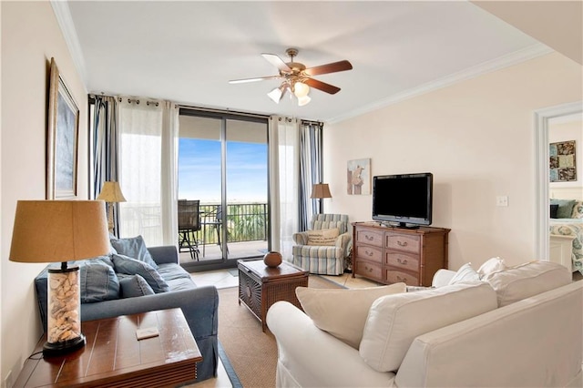 living room featuring crown molding, ceiling fan, and floor to ceiling windows