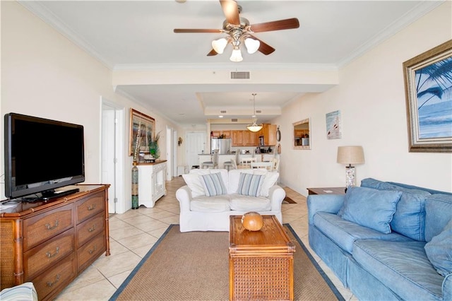 living room with ornamental molding, light tile patterned floors, and ceiling fan