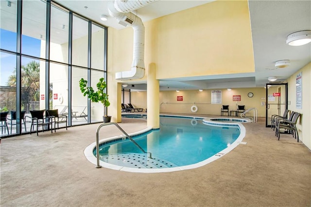 view of pool featuring an indoor hot tub