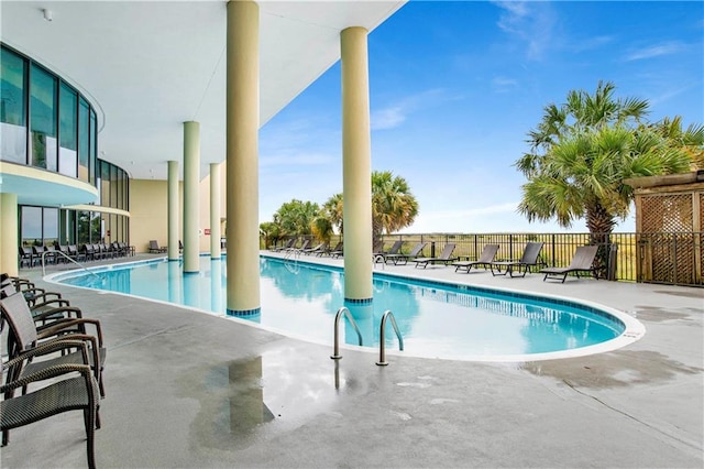 view of swimming pool with a patio