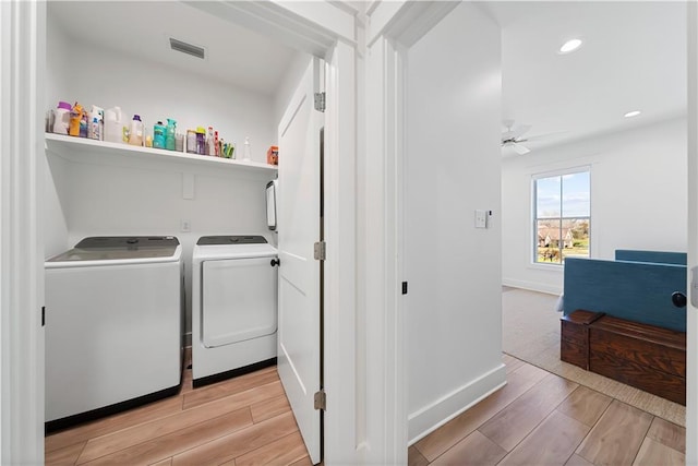 325 Pecan Ridge Blvd, Fairhope, AL 36532 - laundry area featuring light wood-type flooring, visible vents, washer and dryer, and laundry area