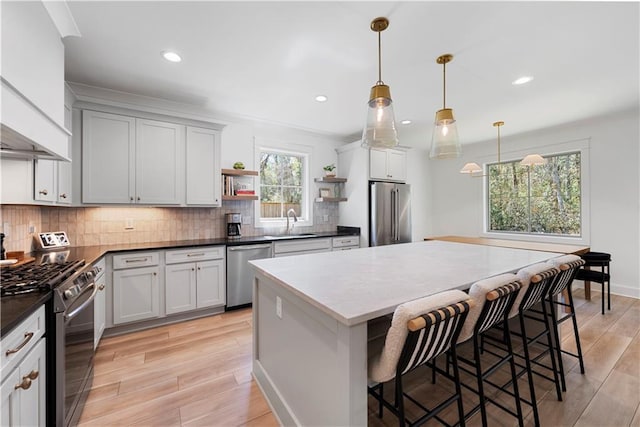 325 Pecan Ridge Blvd, Fairhope, AL 36532 - kitchen featuring open shelves, a sink, appliances with stainless steel finishes, and tasteful backsplash