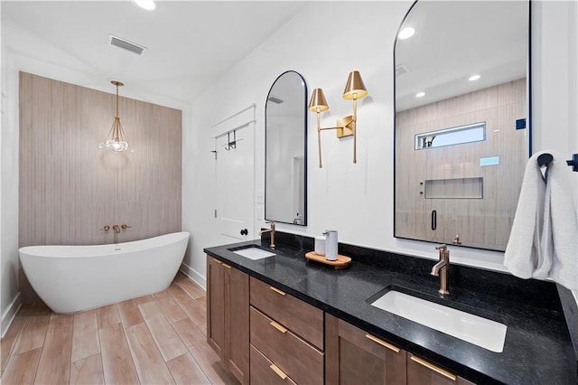 325 Pecan Ridge Blvd, Fairhope, AL 36532 - full bathroom with a freestanding tub, baseboards, visible vents, and a sink