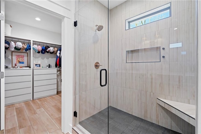 325 Pecan Ridge Blvd, Fairhope, AL 36532 - full bath featuring a walk in closet, wood finished floors, and a stall shower