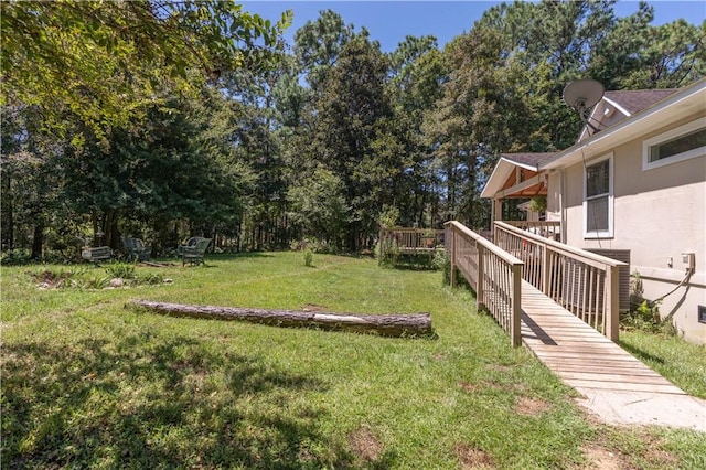 view of yard featuring a wooden deck