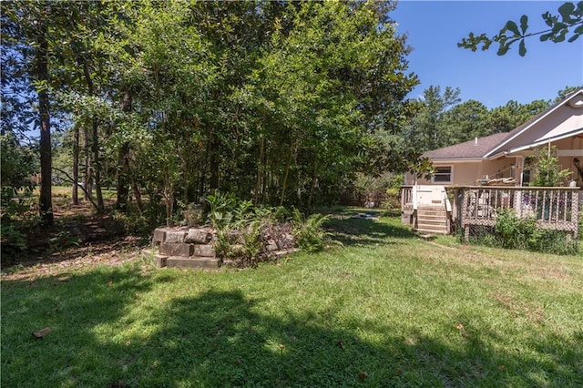 view of yard with a deck