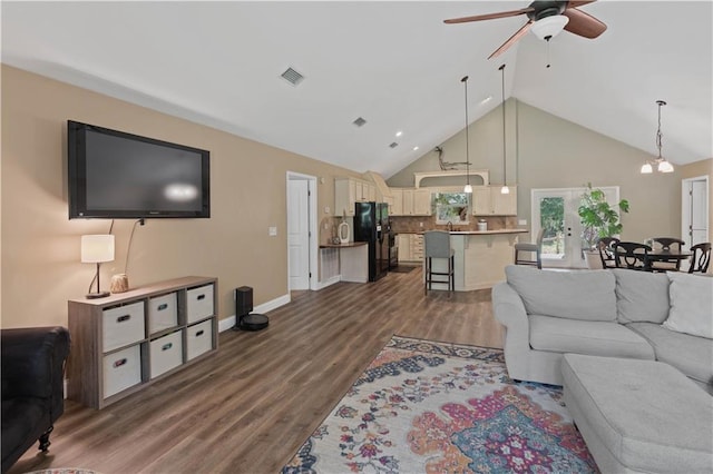 living room with high vaulted ceiling, french doors, ceiling fan with notable chandelier, and wood-type flooring