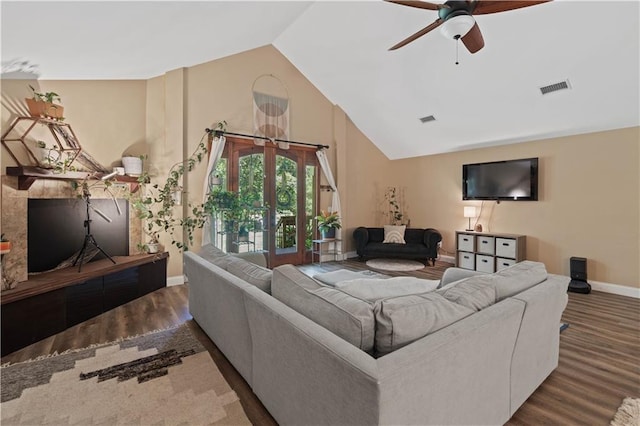 living room with high vaulted ceiling, dark hardwood / wood-style floors, ceiling fan, and french doors