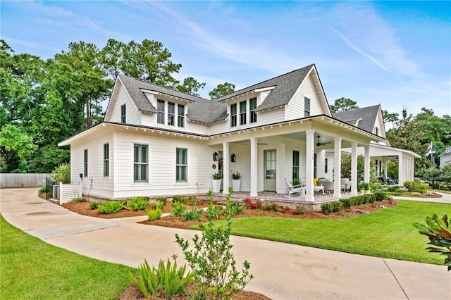 view of front of home with a front yard and covered porch