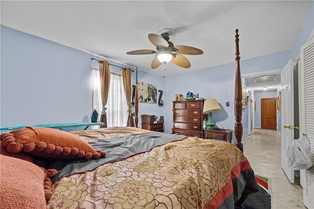 bedroom with ceiling fan and light tile patterned flooring