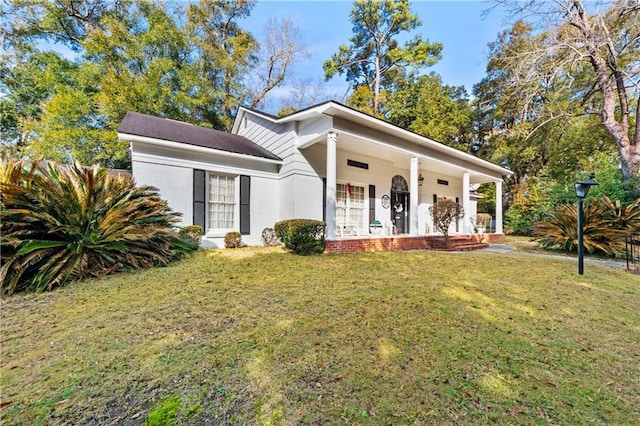 view of front of property with a porch and a front yard