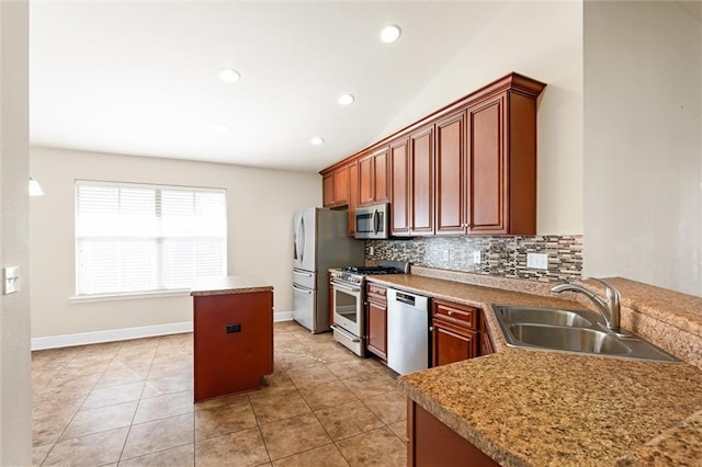 kitchen featuring backsplash, stainless steel appliances, sink, lofted ceiling, and light tile patterned flooring