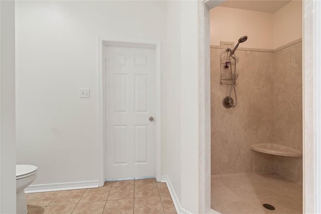 218 Ferry Ave, Saraland, AL 36571 - full bathroom with a tile shower, tile patterned flooring, toilet, and baseboards