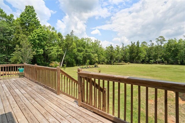218 Ferry Ave, Saraland, AL 36571 - wooden terrace with a lawn and view of wooded area