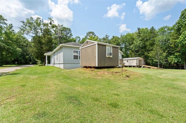 218 Ferry Ave, Saraland, AL 36571 - view of side of home with a yard