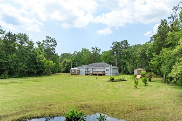 218 Ferry Ave, Saraland, AL 36571 - view of green lawn with a wooden deck