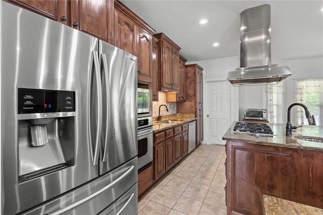 218 Ferry Ave, Saraland, AL 36571 - kitchen with stainless steel appliances, island range hood, dark stone countertops, a sink, and recessed lighting