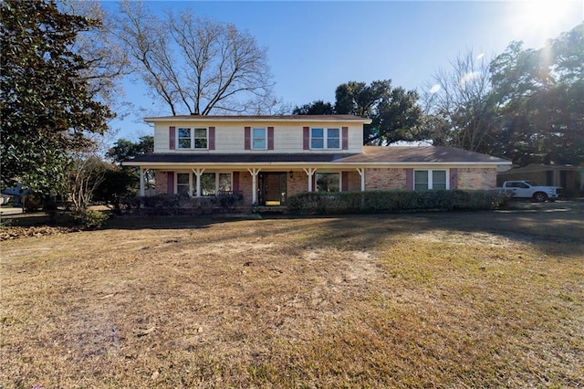 view of front property featuring a front lawn and a porch