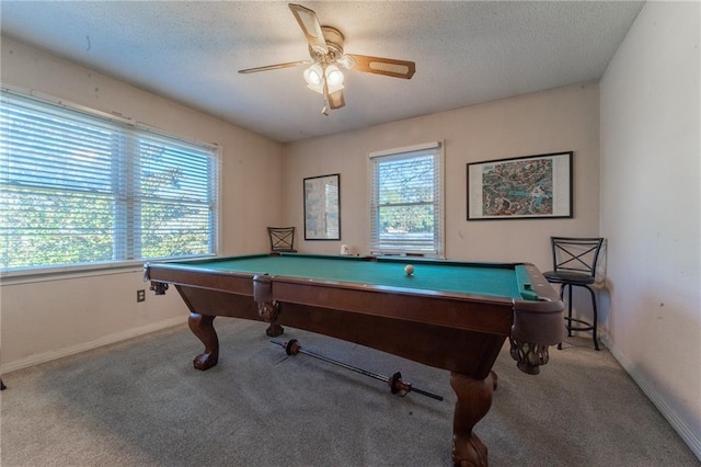 recreation room with light colored carpet, a textured ceiling, and billiards