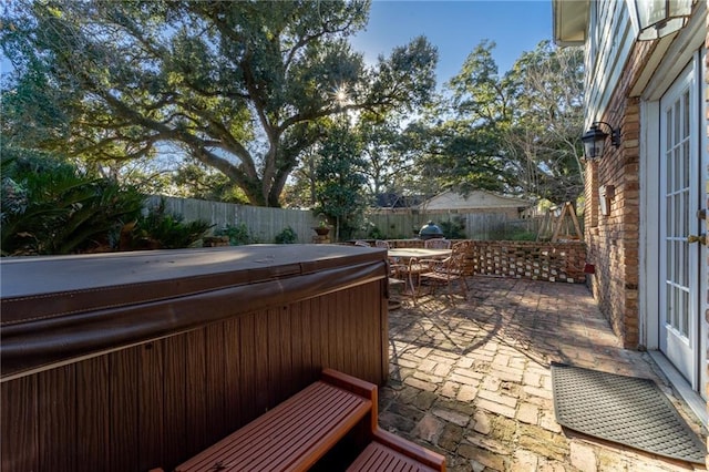 view of patio / terrace featuring a hot tub