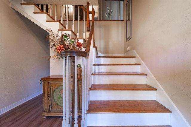 stairs with wood-type flooring