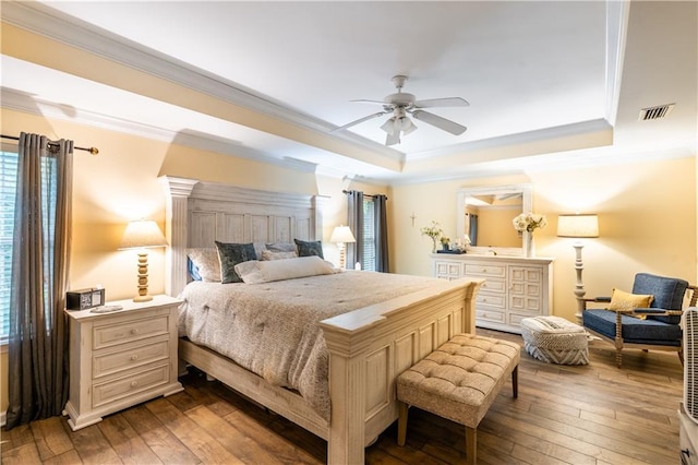 10164 Waterford Way, Mobile, AL 36695 - bedroom with a raised ceiling, crown molding, dark wood-style floors, multiple windows, and a ceiling fan