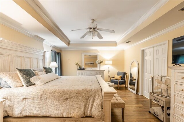 10164 Waterford Way, Mobile, AL 36695 - bedroom with a tray ceiling, wood-type flooring, crown molding, and a ceiling fan