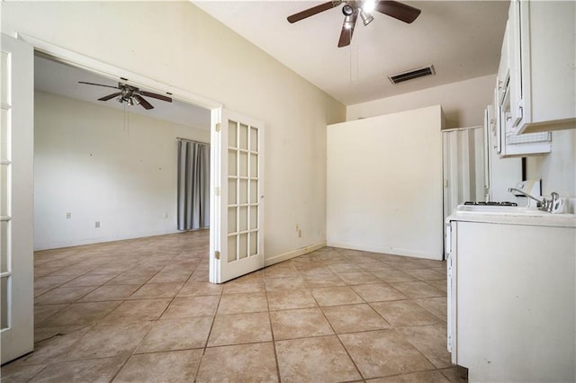 2852 Exter Dr, Mobile, AL 36606 - unfurnished dining area with ceiling fan, french doors, and light tile patterned flooring