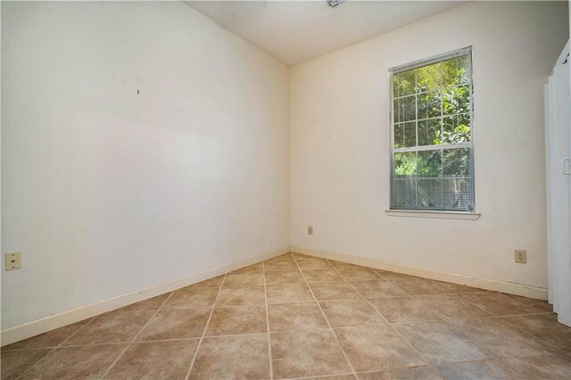 2852 Exter Dr, Mobile, AL 36606 - empty room featuring light tile patterned flooring and baseboards