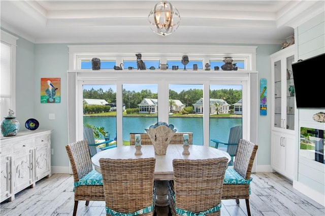 sunroom / solarium featuring a tray ceiling