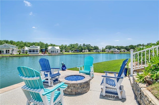 view of patio / terrace featuring a fire pit and a water view