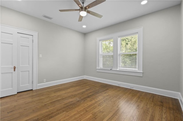 2203 Dauphin St, Mobile, AL 36606 - empty room featuring baseboards, hardwood / wood-style flooring, ceiling fan, and recessed lighting