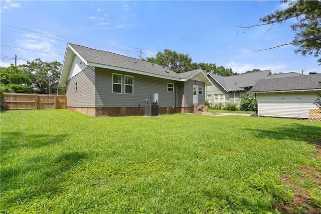 2203 Dauphin St, Mobile, AL 36606 - back of property featuring cooling unit and roof with shingles