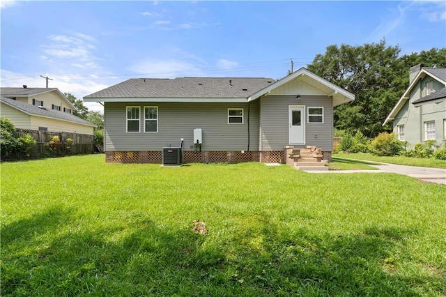 2203 Dauphin St, Mobile, AL 36606 - rear view of house with entry steps, central AC, and a shingled roof