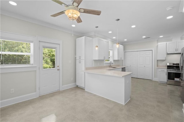 2203 Dauphin St, Mobile, AL 36606 - kitchen with stainless steel electric stove, ornamental molding, plenty of natural light, a sink, and light countertops