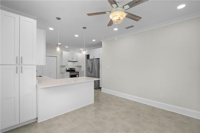 2203 Dauphin St, Mobile, AL 36606 - kitchen featuring appliances with stainless steel finishes, recessed lighting, light countertops, crown molding, and a peninsula