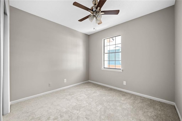 unfurnished room featuring ceiling fan and light colored carpet